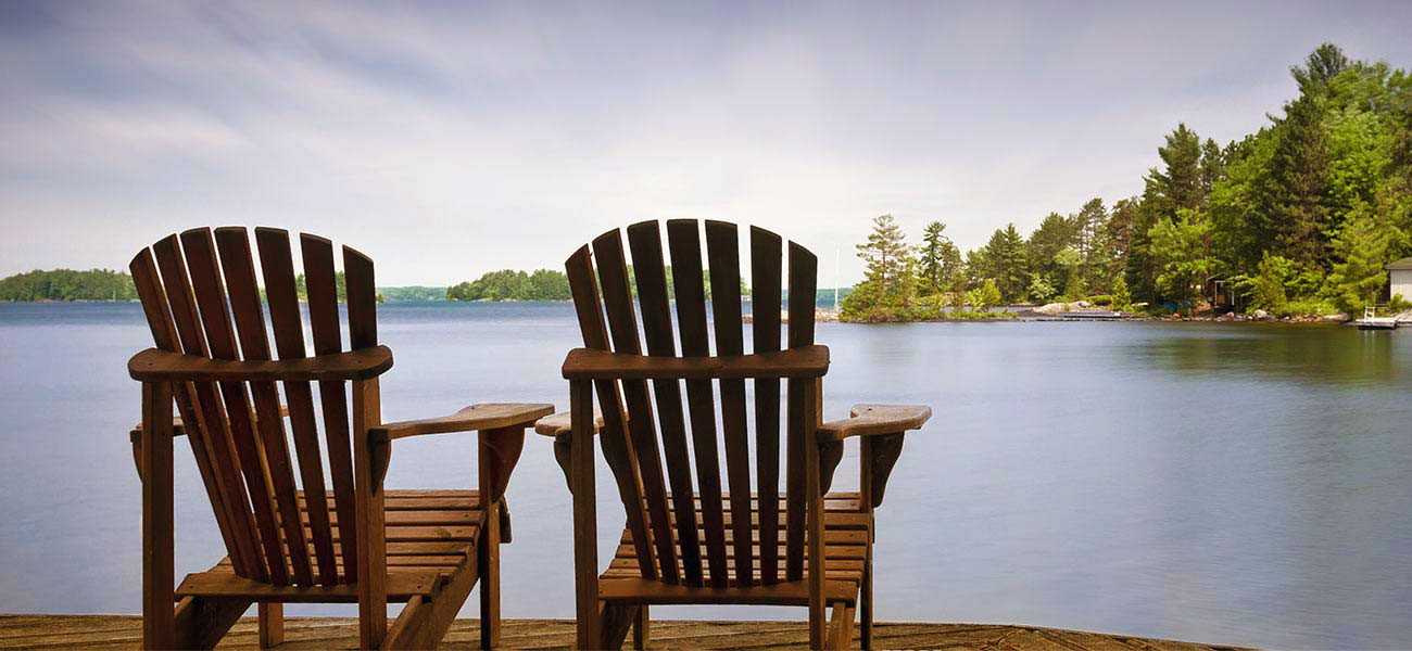 adirondack chairs facing lake george